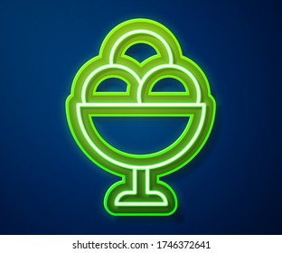 Glowing neon line Ice cream in the bowl icon isolated on blue background. Sweet symbol.  Vector