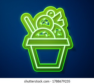 Glowing neon line Ice cream in the bowl icon isolated on blue background. Sweet symbol.  Vector