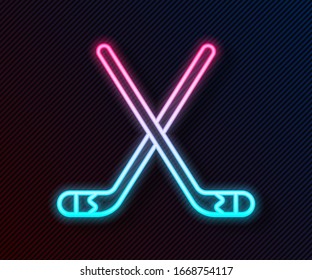 Glowing neon line Ice hockey sticks icon isolated on black background.  Vector Illustration