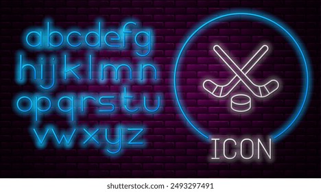 Glowing neon line Ice hockey sticks and puck icon isolated on brick wall background. Game start. Neon light alphabet. Vector