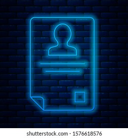 Glowing neon line Identification badge icon isolated on brick wall background. It can be used for presentation, identity of the company, advertising.  Vector Illustration