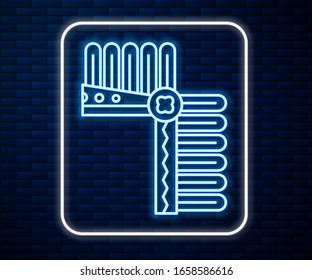 Glowing neon line Indian headdress with feathers icon isolated on brick wall background. Native american traditional headdress.  Vector Illustration