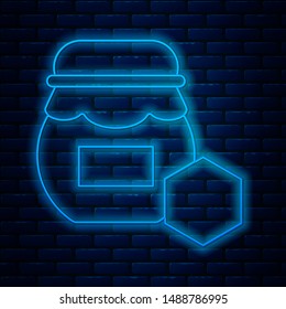Glowing neon line Jar of honey icon isolated on brick wall background. Food bank. Sweet natural food symbol.  Vector Illustration