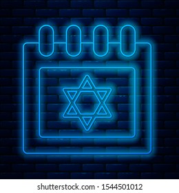 Glowing neon line Jewish calendar with star of david icon isolated on brick wall background. Hanukkah calendar day.  Vector Illustration