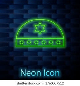 Glowing neon line Jewish kippah with star of david icon isolated on brick wall background. Jewish yarmulke hat. Vector Illustration