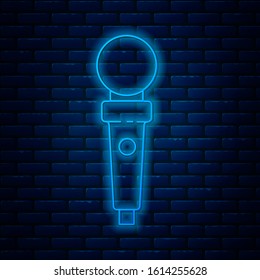 Glowing neon line Joystick for arcade machine icon isolated on brick wall background. Joystick gamepad.  Vector Illustration
