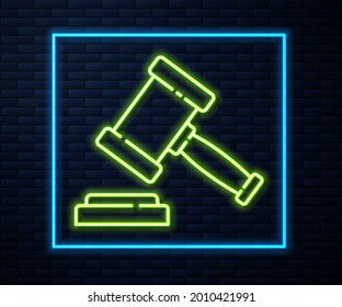 Glowing neon line Judge gavel icon isolated on brick wall background. Gavel for adjudication of sentences and bills, court, justice. Auction hammer.  Vector