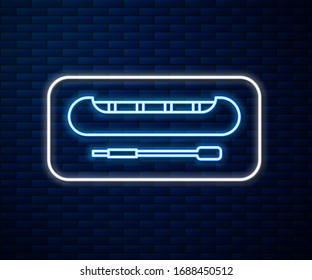 Glowing neon line Kayak and paddle icon isolated on brick wall background. Kayak and canoe for fishing and tourism. Outdoor activities.  Vector Illustration