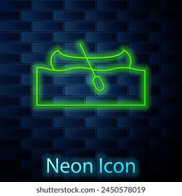 Glowing neon line Kayak and paddle icon isolated on brick wall background. Kayak and canoe for fishing and tourism. Outdoor activities.  Vector