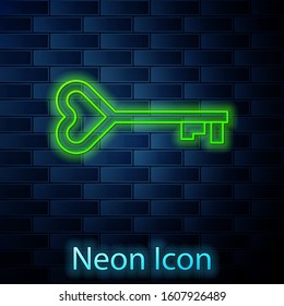 Glowing neon line Key in heart shape icon isolated on brick wall background. Valentines day symbol.  Vector Illustration