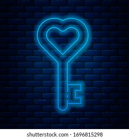 Glowing neon line Key in heart shape icon isolated on brick wall background. 8 March. International Happy Women Day.  Vector Illustration