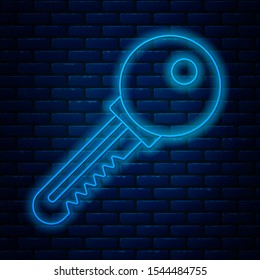 Glowing neon line Key icon isolated on brick wall background.  Vector Illustration