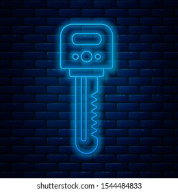 Glowing neon line Key icon isolated on brick wall background.  Vector Illustration