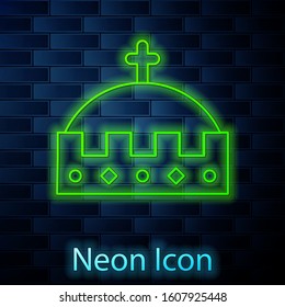 Glowing neon line King crown icon isolated on brick wall background.  Vector Illustration