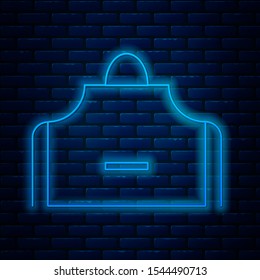 Glowing neon line Kitchen apron icon isolated on brick wall background. Chef uniform for cooking.  Vector Illustration