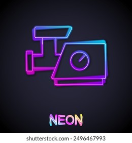 Glowing neon line Kitchen meat grinder icon isolated on black background.  Vector