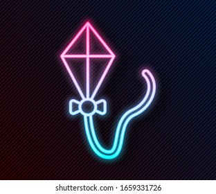 Glowing neon line Kite icon isolated on black background.  Vector Illustration