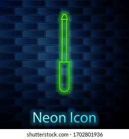 Glowing neon line Knife sharpener icon isolated on brick wall background. Vector Illustration