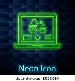 Glowing neon line Laptop application for control a autonomous tractor on a smart farm icon isolated on brick wall background. Smart agriculture implement.  Vector Illustration