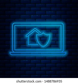 Glowing neon line Laptop with house under protection icon isolated on brick wall background. Protection, safety, security, protect, defense concept.  Vector Illustration