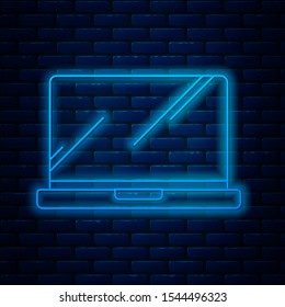 Glowing neon line Laptop icon isolated on brick wall background. Computer notebook with empty screen sign.  Vector Illustration