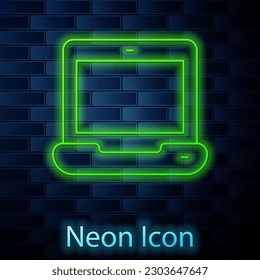 Glowing neon line Laptop icon isolated on brick wall background. Computer notebook with empty screen sign.  Vector