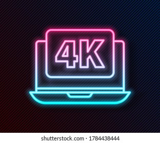 Glowing neon line Laptop screen with 4k video technology icon isolated on black background.  Vector Illustration