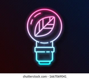 Glowing neon line Light bulb with leaf icon isolated on black background. Eco energy concept. Alternative energy concept.  Vector Illustration