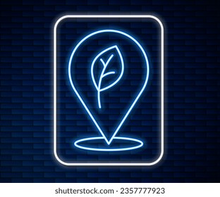 Glowing neon line Location with leaf icon isolated on brick wall background. Eco energy concept. Alternative energy concept.  Vector