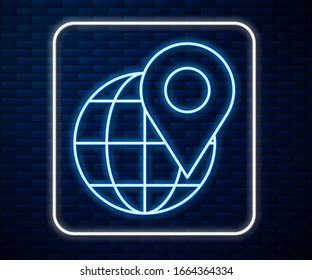 Glowing neon line Location on the globe icon isolated on brick wall background. World or Earth sign.  Vector Illustration