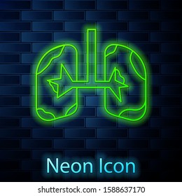 Glowing neon line Lungs icon isolated on brick wall background.  Vector Illustration