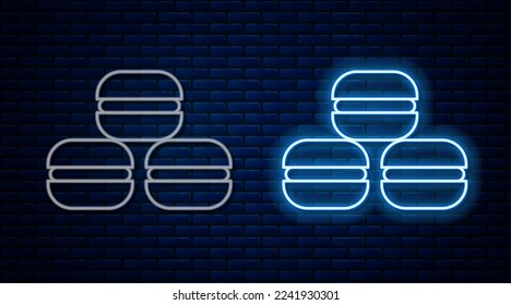 Glowing neon line Macaron cookie icon isolated on brick wall background. Macaroon sweet bakery.  Vector