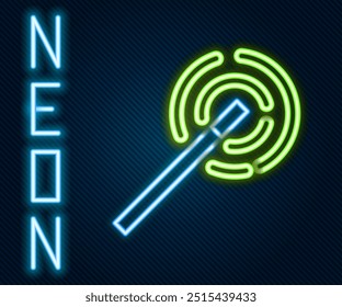 Glowing neon line Magic wand icon isolated on black background. Star shape magic accessory. Magical power. Colorful outline concept. Vector