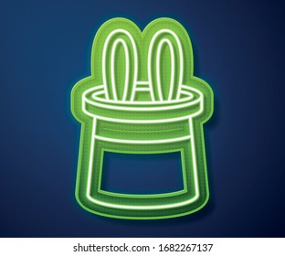 Glowing neon line Magician hat and rabbit ears icon isolated on blue background. Magic trick. Mystery entertainment concept.  Vector Illustration