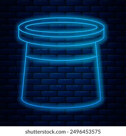 Glowing neon line Magician hat icon isolated on brick wall background. Magic trick. Mystery entertainment concept.  Vector Illustration