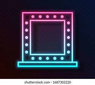 Glowing neon line Makeup mirror with lights icon isolated on black background.  Vector Illustration