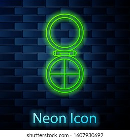 Glowing neon line Makeup powder with mirror icon isolated on brick wall background.  Vector Illustration