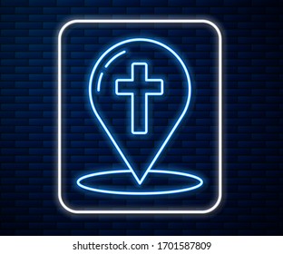 Glowing neon line Map pointer with christian cross icon isolated on brick wall background.  Vector Illustration