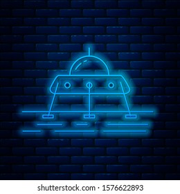 Glowing neon line Mars rover icon isolated on brick wall background. Space rover. Moonwalker sign. Apparatus for studying planets surface.  Vector Illustration