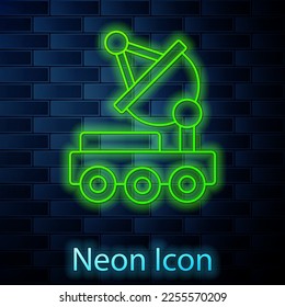 Glowing neon line Mars rover icon isolated on brick wall background. Space rover. Moonwalker sign. Apparatus for studying planets surface.  Vector