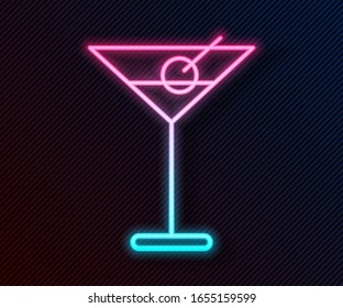 Glowing neon line Martini glass icon isolated on black background. Cocktail icon. Wine glass icon.  Vector Illustration