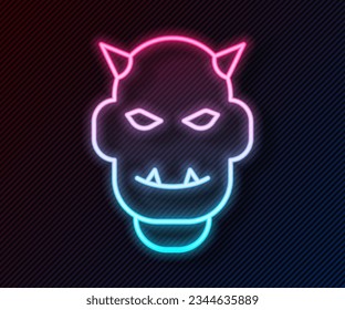 Glowing neon line Mask of the devil with horns icon isolated on black background.  Vector