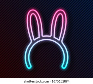 Glowing neon line Mask with long bunny ears icon isolated on black background.  Vector Illustration