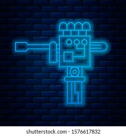 Glowing neon line Mechanical robot hand and screwdriver tool icon isolated on brick wall background. Robotic arm symbol. Technological concept.  Vector Illustration