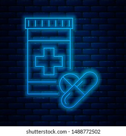 Glowing neon line Medicine bottle and pills icon isolated on brick wall background. Bottle pill sign. Pharmacy design.  Vector Illustration