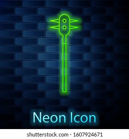 Glowing neon line Medieval chained mace ball icon isolated on brick wall background. Medieval weapon.  Vector Illustration