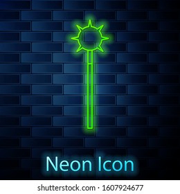 Glowing neon line Medieval chained mace ball icon isolated on brick wall background. Medieval weapon.  Vector Illustration