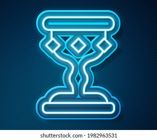 Glowing neon line Medieval goblet icon isolated on blue background.  Vector