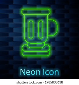 Glowing neon line Medieval goblet icon isolated on brick wall background.  Vector