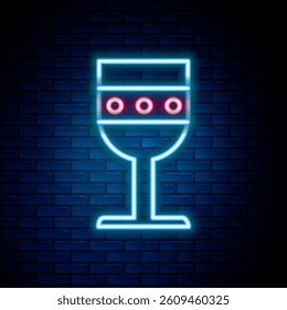 Glowing neon line Medieval goblet icon isolated on brick wall background. Colorful outline concept. Vector